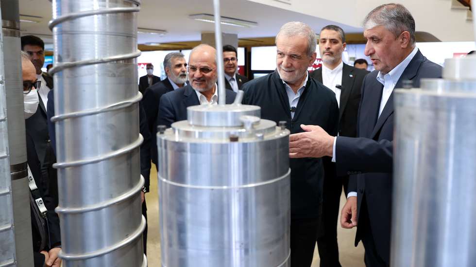 epa12019958 A handout photo made available by Iranian Presidential Office shows, Iranian president Masoud Pezeshkian (2R) and head of Iranian Atomic Organization Mohammad Eslami (R) as they visit a nuclear achievement exhibition during a ceremony marking Iran's Atomic Technology Day in Tehran, Iran, 09 April 2025.  EPA/IRANIAN PRESIDENT OFFICE HANDOUT HANDOUT EDITORIAL USE ONLY/NO SALES
