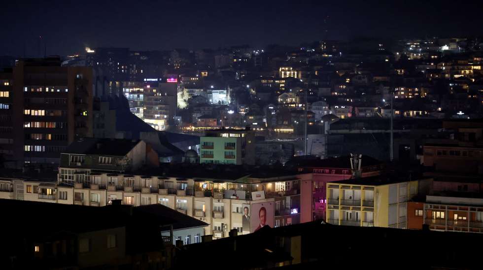 epa11884921 A billboard depicting the incumbent Prime Minister and leader of the 'Vetevendosje' party, Albin Kurti, is seen as the night falls in Pristina, Kosovo, 09 February 2025. About two million voters were eligible to vote on 09 February for the 120 seats in Kosovo's parliament, 20 of which are reserved for ethnic Serbs and other minorities.  EPA/GEORGI LICOVSKI