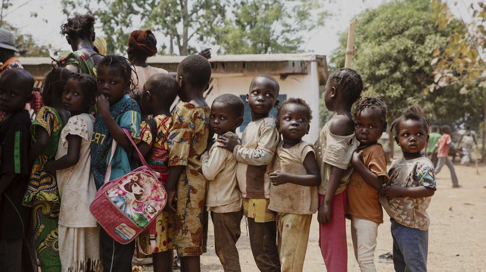 epaselect epa09002032 Children Internally displaced people (IDP's) from the Central African Republic wait to be registered by an NGO in Liton, Central African Republic, 10 February 2021. The Central African Republic has extended the current state of emergency for six months as the fight against a coalition of rebel groups not part of this peace agreement continues. The IDPs have been given food aid by the organisation PAM once, and non-food items by Action Contre la Faim. More international organisations are waiting for possibilities of actions but even though Liton is only 22 kilometers away from Bangui they haven't been able to reach due to security concerns. 2559 people have been displaced in the village of Liton, in the Central African Republic mid-January. They fled when alert was given that more than a hundred armed men from the Coalition of Patriots for Change (CPC) a coalition of armed groups formed on 19 December 2020 prior to the elections. More than 240,000 people have left their homes, to take refuge in neighbouring countries, or inside the Central African Republic since 15 December 2020 according to the United Nations Office for the Coordination of Humanitarian Affairs (OCHA).  EPA/ADRIENNE SURPRENANT