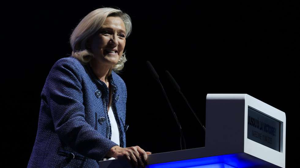 epa12067600 President of the far-right Rassemblement National (RN) parliamentary group, Marine Le Pen, attends a meeting during the party's traditional May Day gathering in Narbonne, southern France, 01 May 2025. Labor Day, or May Day, is observed worldwide on the first day of May to celebrate the economic and social achievements of workers and fight for laborers' rights.  EPA/GUILLAUME HORCAJUELO