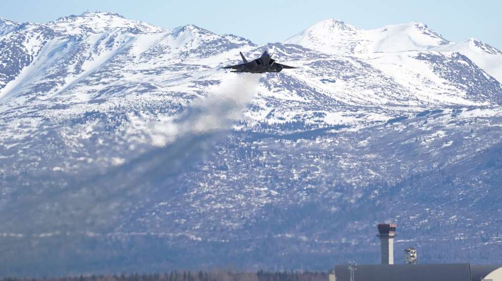epa07469137 A handout photo made available by the US Air Force on 28 March 2019 shows an F-22 Raptor taking off after Raptors from the 3rd Wing and 477th Fighter Group participated in a close formation taxi, known as an 'Elephant Walk,' during a Polar Force exercise at Joint Base Elmendorf-Richardson, Alaska, USA, 26 March 2019. The two-week exercise gave squadrons an opportunity to demonstrate their abilities to forward deploy and deliver overwhelming combat airpower.  EPA/US AIR FORCE/JUSTIN CONNAHER HANDOUT  HANDOUT EDITORIAL USE ONLY