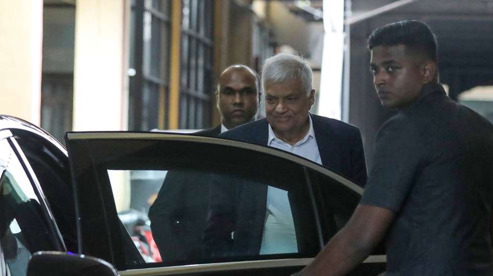 epa12059928 Former Sri Lankan President Ranil Wickremesinghe (C) leaves the Commission to Investigate Allegations of Bribery or Corruption, after giving a statement related to an ongoing investigation under the Anti-Corruption Act, in Colombo, Sri Lanka, 28 April 2025. The former president was summoned over a statement he allegedly made concerning MP Chamara Sampath Dassanayake, who was earlier arrested and brought before the courts under the Anti-Corruption Act.  EPA/CHAMILA KARUNARATHNE