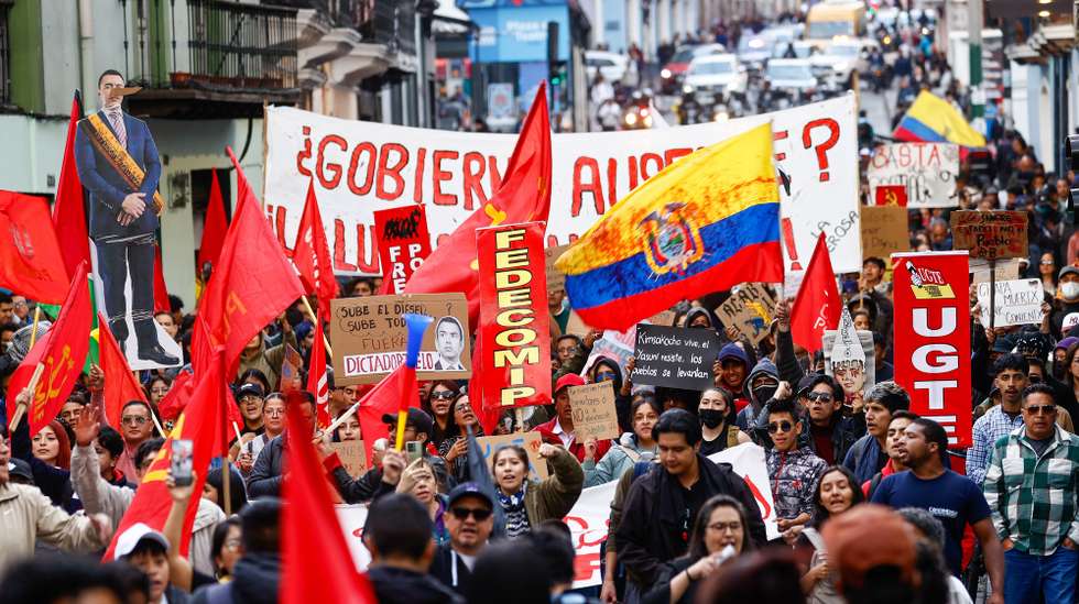 epa12383780 People hold signs during a demonstration against the elimination of diesel subsidies in Quito, Ecuador, 16 September 2025.  EPA/JOSE JACOME