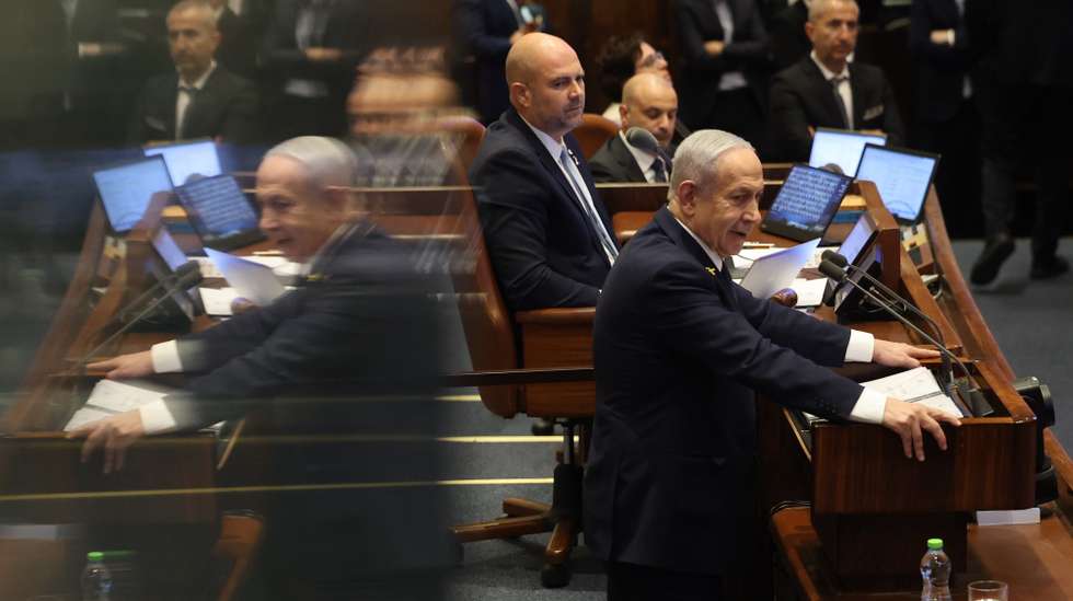 epa12516443 Israel's Prime Minister Benjamin Netanyahu speaks during a plenary session at the Knesset, the Israeli parliament in Jerusalem, 10 November 2025. The session has been initiated by the opposition demanding the establishment of a state inquiry conference to investigate the 07 October 2023 massacre.  EPA/ABIR SULTAN