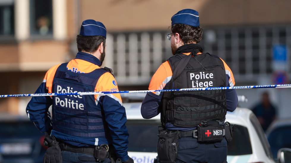 epa12805681 Police officers secure the area outside a synagogue after an explosion in Liege, Belgium, 09 March 2026. The blast occurred at around 04:00 local time outside the synagogue on Rue Leon Fredericq, shattering windows and causing material damage, while no injuries were reported, as Belgian authorities launched an investigation into the incident.  EPA/OLIVIER HOSLET