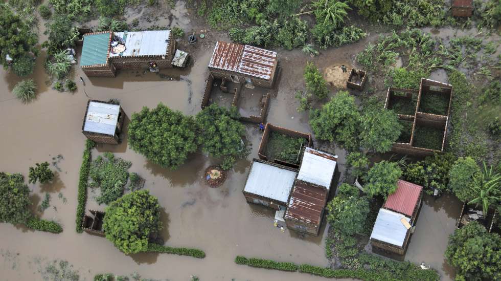epa12664696 An aerial view shows the flooded 03 February neighbourhood between the Maputo and Gaza regions, Maputo, Mozambique, 20 January 2026. Rescue efforts continue for hundreds of families cut off by flooding, with some taking refuge on rooftops, car roofs, or in treetops in southern Mozambique after days of near-continuous rain that has also forced dams, including some in neighbouring countries, to increase water releases.  EPA/LUISA NHANTUMBO