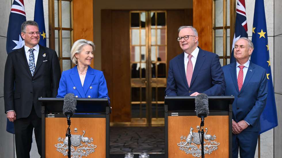 epa12845106 Australian Prime Minister Anthony Albanese (R) and President of the European Commission Ursula von der Leyen (L) speak to the media during a press conference at Parliament House in Canberra, Australia, March 24, 2026.  EPA/LUKAS COCH AUSTRALIA AND NEW ZEALAND OUT