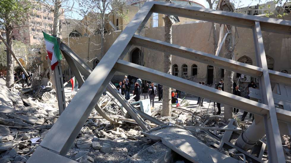 epa12872922 Members of the media work amid the debris of a damaged building at the Sharif University after an airstrike in Tehran, Iran, 07 April 2026. A joint Israeli and US military operation continues to target multiple locations across Iran since the early hours of 28 February 2026.  EPA/ABEDIN TAHERKENAREH