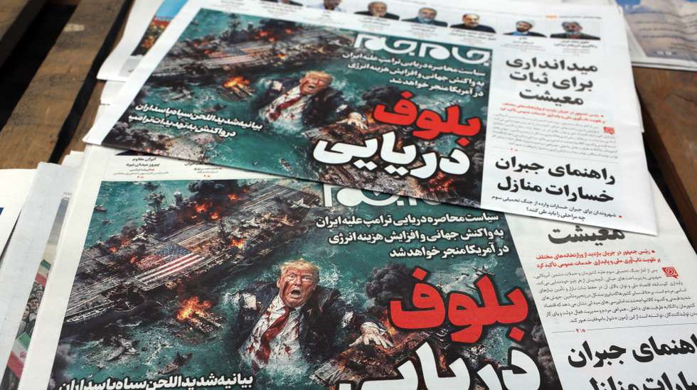 epa12886774 A stack of copies of the Iranian daily newspaper Jame Jam with the headline 'Sea Bluff' is displayed outside a kiosk in Tehran, Tehran, Iran, 13 April 2026. The conflict between Iran and the US over the Strait of Hormuz continues.  EPA/ABEDIN TAHERKENAREH