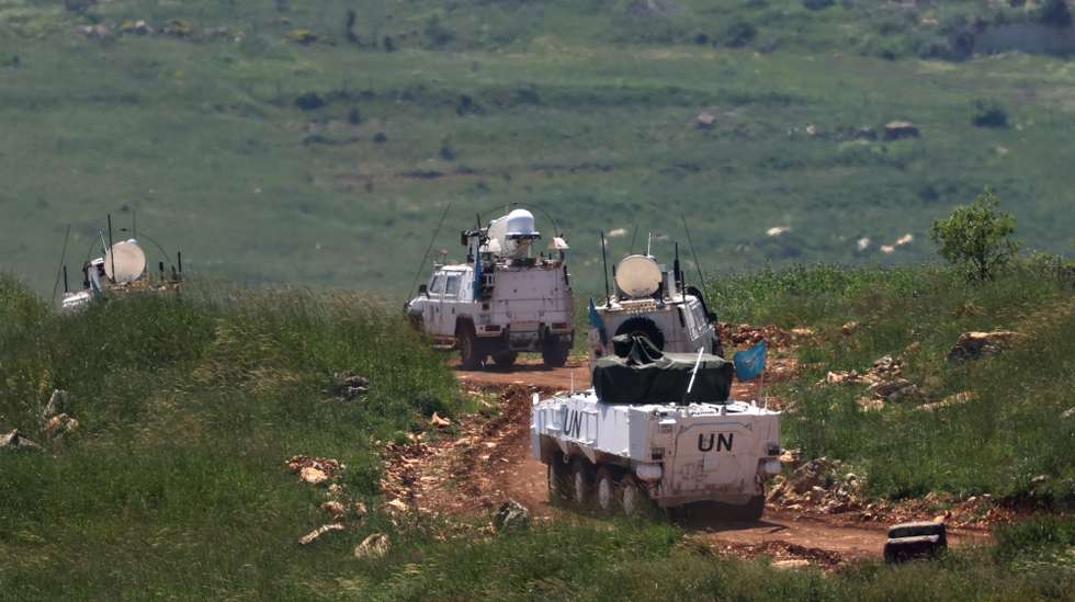 epa12921388 A United Nations Interim Force in Lebanon (UNIFIL) convoy leaving their base, in south Lebanon, as seen from the upper Galilee on the Israel-Lebanon border, 29 April 2026.  EPA/ATEF SAFADI