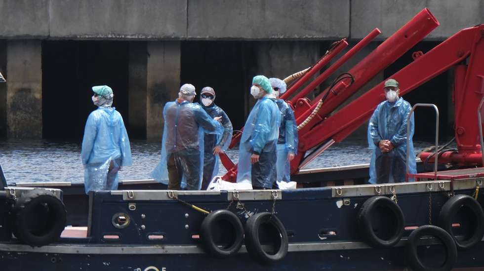 epa12945541 The disembarkation of passengers and crew from the MV Hondius cruise ship continues at the Port of Granadilla de Abona in Tenerife, Spain, 10 May 2026. The ship was affected by a hantavirus outbreak during its South Atlantic crossing, which left three people dead.  EPA/ALBERTO VALDES
