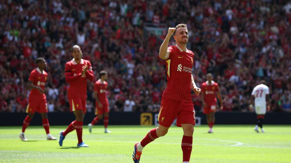 epa11545195 Diogo Jota of Liverpool celebrates scoring the 0-1 goal during the friendly soccer match between Liverpool and Sevilla in Liverpool, Britain, 11 August 2024.  EPA/ADAM VAUGHAN