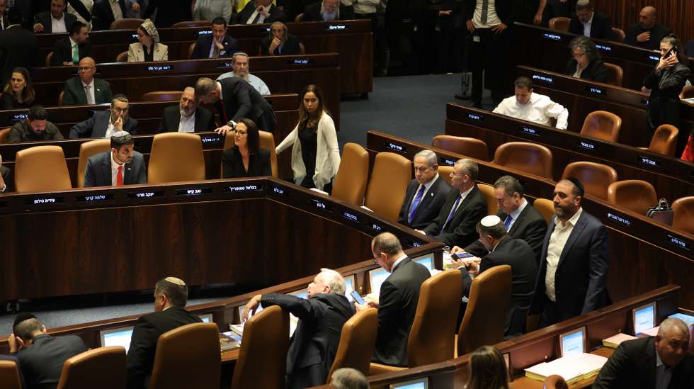 epa10766006 Israeli Prime Minister Benjamin Netanyahu (C) attends a Knesset session to vote on law on justice system reform, Israel, 24 July 2023. Mass protests continue across the country as the Israeli parliament, or Knesset, is set to hold a final vote on the bill that would limit the Supreme Court's powers.  EPA/ABIR SULTAN