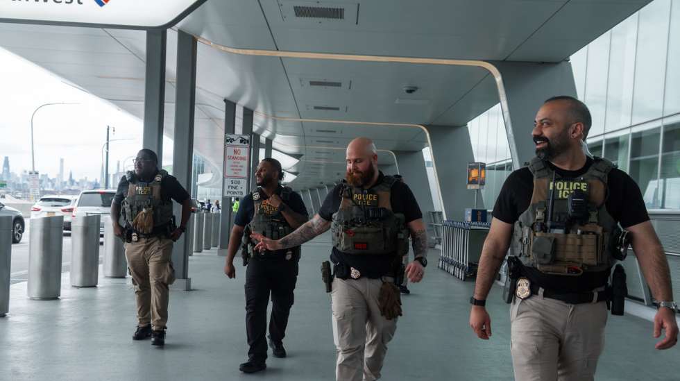 epa12854951 Immigration and Customs Enforcement (ICE) officers walk outside Terminal B of LaGuardia International Airport in New York, New York, USA, 27 March 2026. ICE officers were deployed at major U.S. airports to support security operations during severe TSA staffing shortages.  EPA/OLGA FEDOROVA