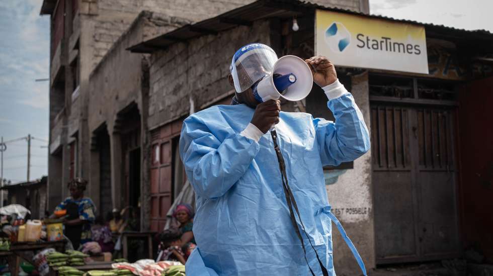 epa13002649 A coordinator with U-Reporters, an UNICEF program to engage and inform local communities, wears a protective gown as he takes part in a campaign to raise awareness against Ebola in Goma, North Kivu, Democratic Republic of Congo, 29 May 2026. The World Health Organization (WHO) has declared that the Ebola disease caused by the Bundibugyo virus in the Democratic Republic of the Congo and Uganda constitutes a public health emergency of international concern (PHEIC).  EPA/MARIE JEANNE MUNYERENKANA