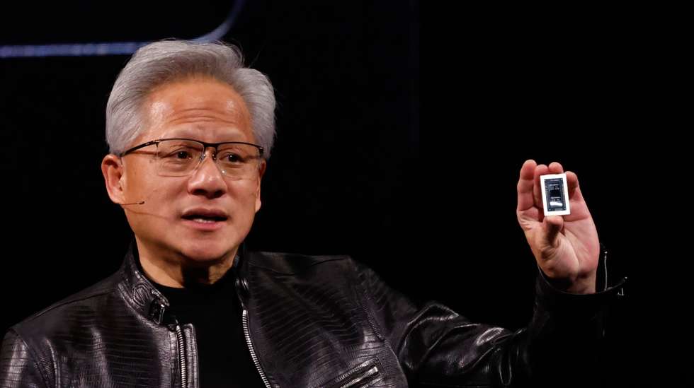 epa13008181 NVIDIA CEO Jensen Huang shows the RTX Spark during his keynote speech as part of the COMPUTEX 2026 AI exhibition in Taipei, Taiwan, 01 June 2026. Jensan Huang officially announced NVIDIA’s new products and various AI integration.  EPA/RITCHIE B. TONGO