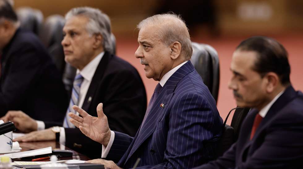 epa12992954 Pakistan's Prime Minister Shehbaz Sharif (C), Deputy Prime Minister Ishaq Dar (L), and army chief Asim Munir (R) attend a meeting with Chinese President Xi Jinping at the Great Hall of the People, in Beijing, China, 25 May 2026.  EPA/TINGSHU WANG / POOL