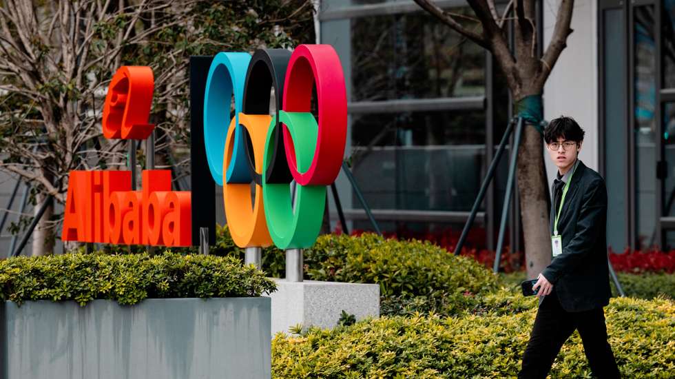 epa12832581 A man walks past Alibaba logo on their building in Xuhuibinjiiang Park, also known as 'AI Park,' home to many Chinese companies involved in AI (artificial intelligence) research, in Shanghai, China, 19 March 2026.  EPA/ALEX PLAVEVSKI