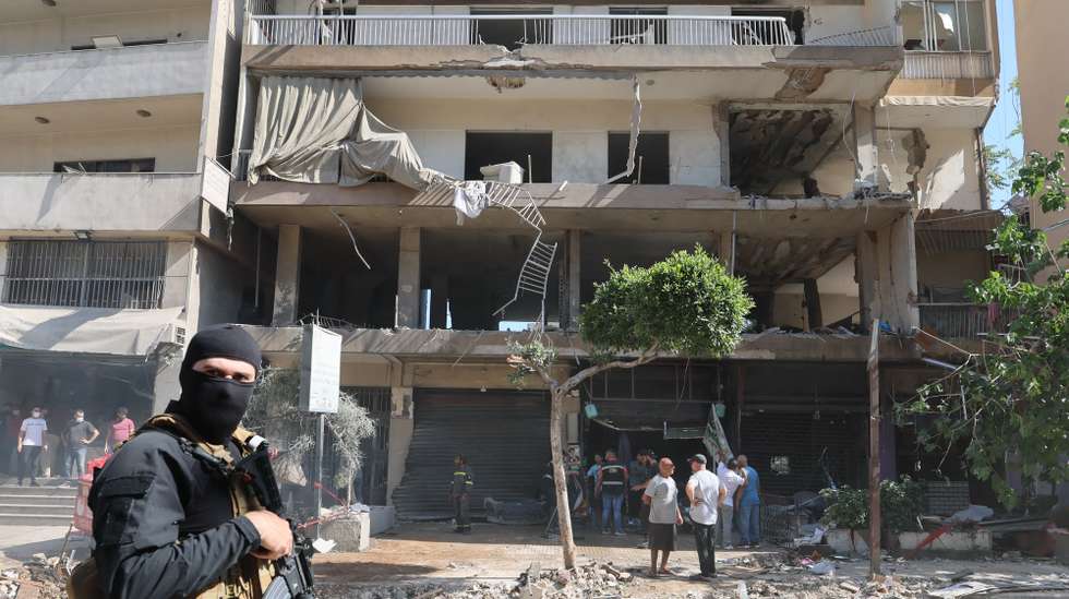 epa13036299 A Lebanese security serviceman stands near the site of an apartment targeted by an Israeli airstrike in Beirut’s southern suburbs, Lebanon, 14 June 2026.  EPA/WAEL HAMZEH