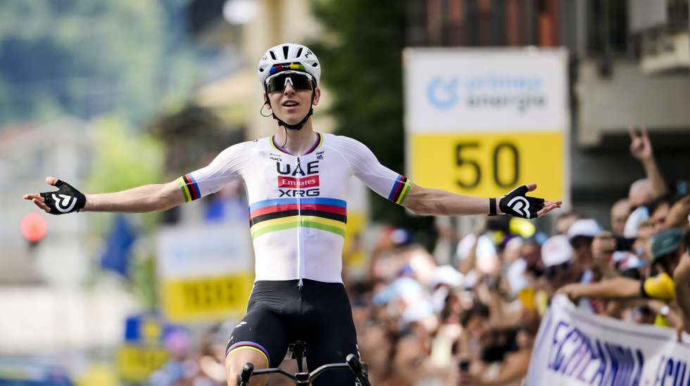 epa13044551 The winner of the stage Tadej Pogacar from Slovenia of UAE Team Emirates-XRG celebrates after crossing the finish line during the first stage of the 89th Tour de Suisse UCI World Tour cycling race, a 144 km race with start and finish in Sondrio, Italy, 17 June 2026.  EPA/GIAN EHRENZELLER