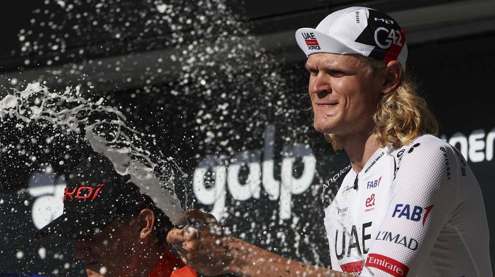Danish rider Julius Johansen of UAE team Emirates - XRG celebrates in the podium after the fifth stage of the 87th Portugal Cycling Tour cycling race a individual time trial over 17,4 km, from Anadia to Águeda, Portugal, 10 August 2026. NUNO VEIGA/LUSA