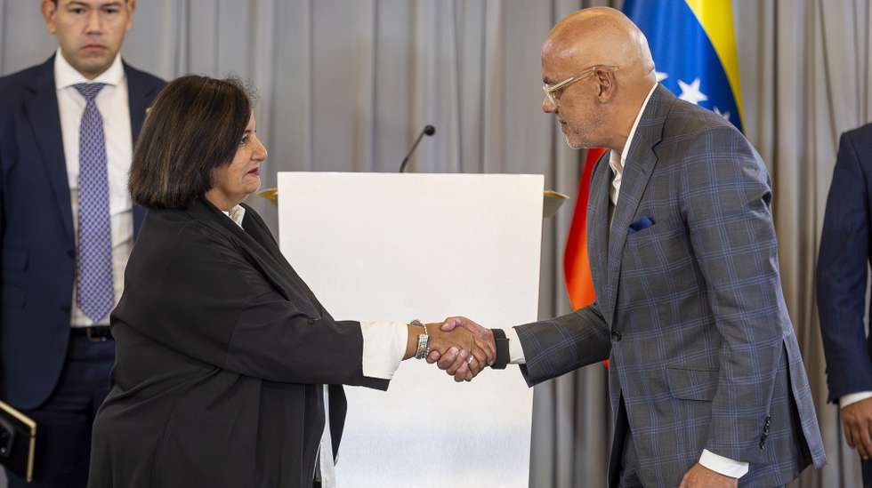epa13165692 Dinorah Figuera (L), former president of the Venezuelan National Assembly in 2015, and National Assembly President Jorge Rodriguez shake hands during the final session of the dialogue table in Caracas, Venezuela, 12 August 2026. Representatives of Venezuela's government and opposition agreed to replace all magistrates of the Supreme Court of Justice (TSJ) as part of the first agreements reached in US-backed talks aimed at a political transition.  EPA/MIGUEL GUTIERREZ