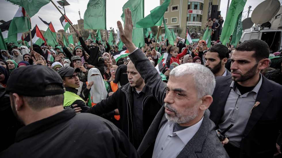 epa09065848 (FILE) - Hamas Gaza leader Yahya Al Sinwar (C) waves to supporters during a Hamas rally to mark the 31st anniversary of the group, in Gaza City, Gaza Strip, 16 December 2018 (reissued 10 March 2021). Sinwar was re-elected as Gaza Hamas leader on 10 March 2021.  EPA/MOHAMMED SABER *** Local Caption *** 54846862