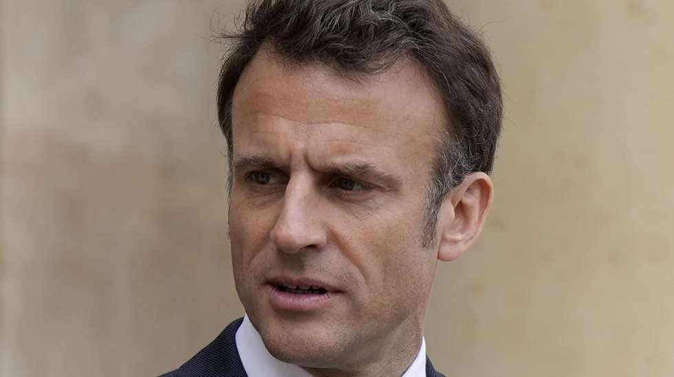 epa10571956 French President Emmanuel Macron looks on as he talks with Senegalese war veterans at the Elysee Palace in Paris, France, 14 April 2023. Some of the last survivors in France from a colonial-era infantry corps that recruited tens of thousands of African soldiers to fight in French wars around the world will be able to live out their final days with family members back in Africa after a French government U-turn earlier this year on their pension rights.  EPA/Lewis Joly / POOL   MAXPPP OUT