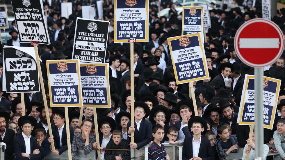 epaselect epa11272514 Ultra Orthodox Jews during a protest against army recruitment outside the military recruitment office in Jerusalem, 11 April 2024. Israel's Supreme Court gave the government an 01 April deadline to present a plan to withdraw military service exemption for ultra-Orthodox Jews studying full time in religious seminaries. After the government on 28 March asked for a 30-day extension, the Supreme Court issued an interim order to stop government funding for religious students starting 01 April.  EPA/ABIR SULTAN