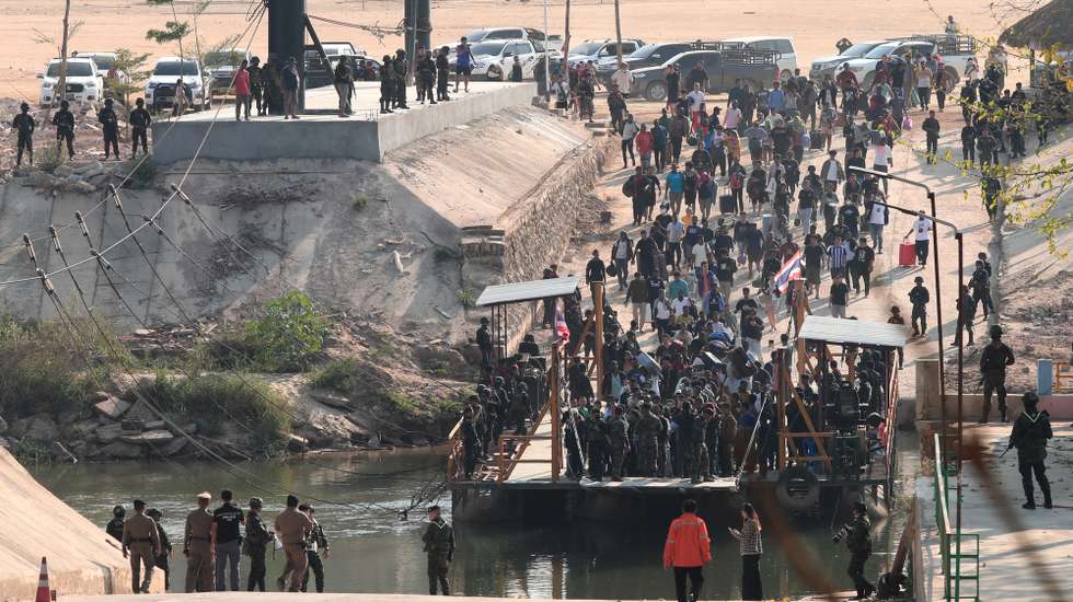 epa11890710 People who were rescued from scam centers cross from Myanmar to Thailand aboard a barge, at the Myanmar-Thai border of Phop Phra district, near Mae Sot, Tak province, northern Thailand, 12 February 2025. A total of 261 people of various nationalities, who were lured and trafficked by suspected Chinese-operated call center scammer gangs, were rescued by Myanmarâ€™s Democratic Karen Buddhist Army (DKBA) and handed over to Thai authorities, according to Thai commander of the Rajamanu Task Force, Nattakorn Rueantip.  EPA/SOMRERK KOSOLWITTHAYANANT