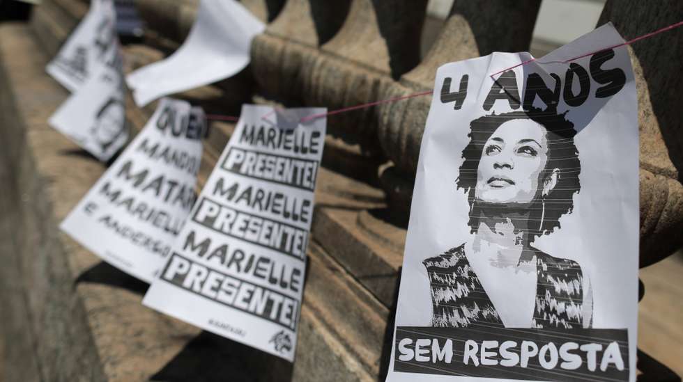 epa09824581 A view of banners during an act to mark the four years anniversary since the assassination of the Brazilian councilor and human rights activist Marielle Franco, organized by Amnesty International, in Rio de Janeiro, Brazil, 14 March 2022. Marielle Franco, black, homosexual, from a favela in Rio de Janeiro and who stood out for her energetic action in defense of minorities, was shot dead on March 14, 2018 along with the driver of her vehicle Anderson Gomes, after participating in a political meeting in the city center.  EPA/Andre Coelho