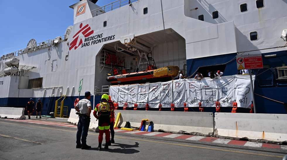 epa11403495 The crew of Doctors Without Borders (MSF) search and rescue vessel 'Geo Barents' display 11 white bags used to recover the bodies of dead migrants and life jackets with the words reading 'Europe...How many more?', to symbolize the bodies recovered at sea, upon arrival at the port of Genoa, Italy, 11 June 2024. Geo Barents ship docked at the port carrying 165 migrants, mainly from Eritrea, rescued in the Libyan area. Among the rescued migrants are 109 recovered onboard a rubber dinghy and 37 from a fiberglass boat. There are 33 minors on board, around thirty of whom are unaccompanied. While traveling towards Genoa, the ship recovered 11 bodies at sea for migrants who drowned in a previous shipwreck, before they were transferred to a Coast Guard patrol boat near Lampedusa.  EPA/LUCA ZENNARO