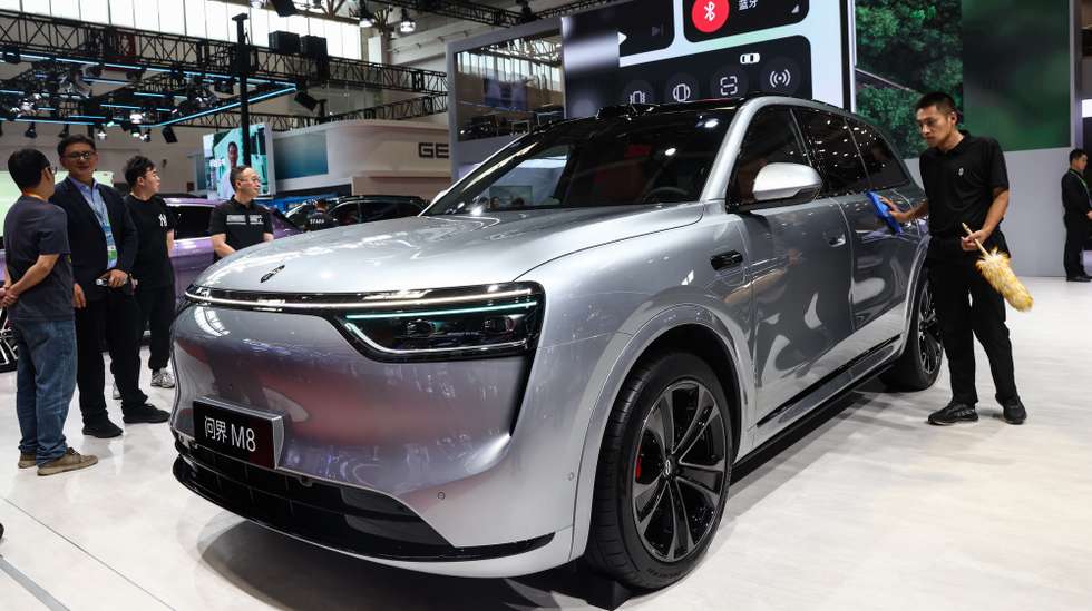 epa12240887 Visitors look at Huawei’s AITO M8 electric car at the third China International Supply Chain Expo (CISCE) in Beijing, China, 16 July 2025. The expo runs from 16 to 20 July 2025 under the theme 'Connecting the World for a Shared Future'.  EPA/WU HAO