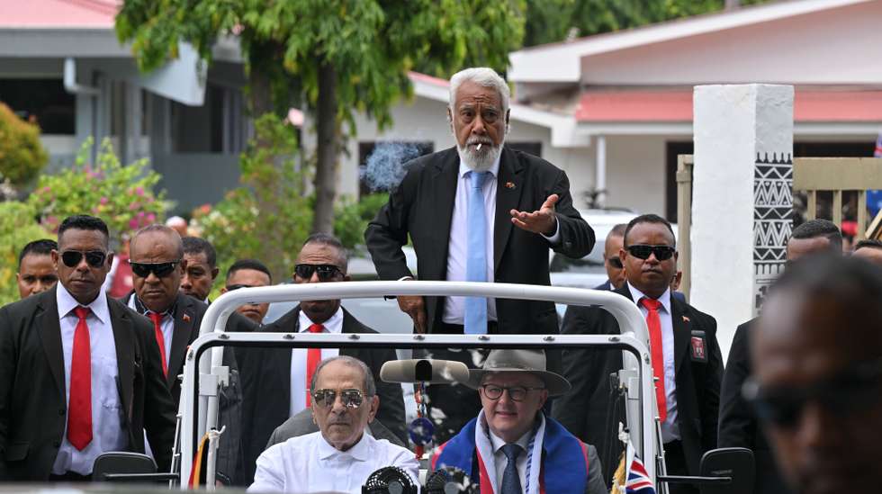 epa12686479 Australian Prime Minister Anthony Albanese (bottom, R) is driven in a mini moke by Timor Leste’s President Jose Ramos Horta (bottom, L) as Timor Leste’s Prime Minister Xanana Gusmao (C) lights a cigarette after arriving for an official visit in Dili, Timor-Leste, 28 January 2026.  EPA/MICK TSIKAS AUSTRALIA AND NEW ZEALAND OUT