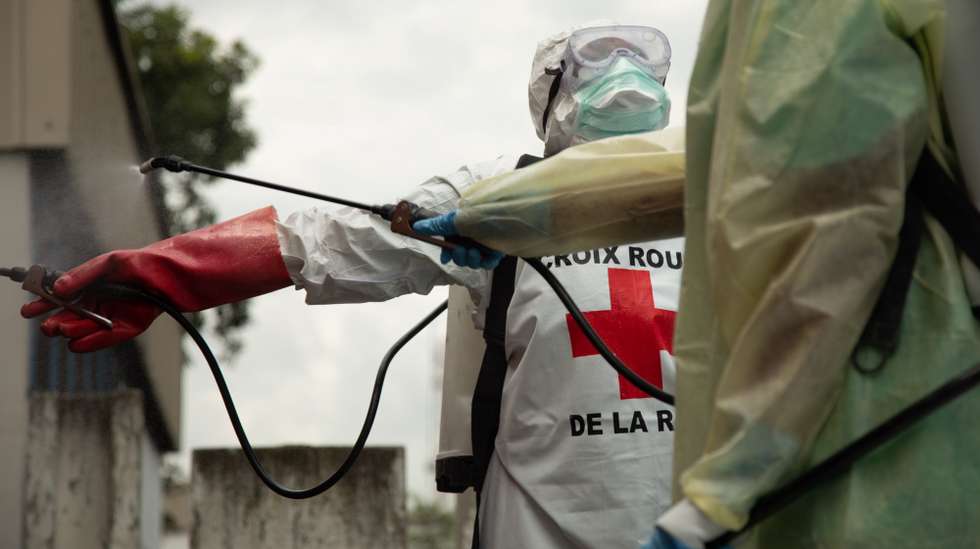 epa07624722 A handout picture provided by the International Federation of Red Cross and Red Crescent (IFRC) shows a Safe and Dignified Burial team (SDB) at a hospital morgue where a woman has died of unexplainable symptomes, in Goma, The Democratic Republic Of The Congo, 29 May 2019 (issued 04 June 2019). The team responds to alerts of suspected ebola deaths and of all unidentifiable deaths.  EPA/MARIA SANTTO / FINNISH RED CROSS / IFRC HANDOUT  HANDOUT EDITORIAL USE ONLY/NO SALES