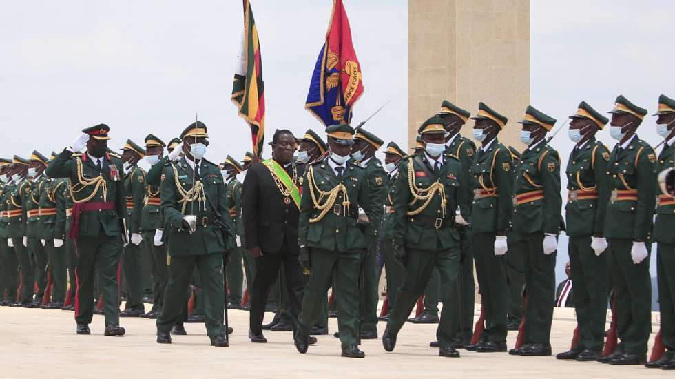 epa10323278 Zimbabwean President Emmerson Mnangagwa inspect the guard of honor before delivering the State of The Nation Address and officially open the fifth session of the Ninth Parliament in the newly built Parliament building in Mount Hampden, Zimbabwe, 23 November 2022.  EPA/AARON UFUMELI