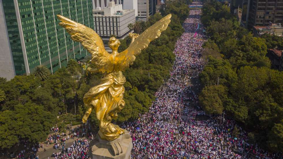 epa10304460 Photograph taken from a drone showing thousands of people marching along the renowned Paseo de la Reforma avenue, in Mexico City, Mexico, 13 November 2022. Thousands of people, mostly opponents, marched this Sunday through the streets of Mexico City and other cities in the country in defense of the National Electoral Institute (INE) and against the controversial electoral reform promoted by the country&#039;s president, Andres Manuel Lopez Obrador.  EPA/ISAAC ESQUIVEL