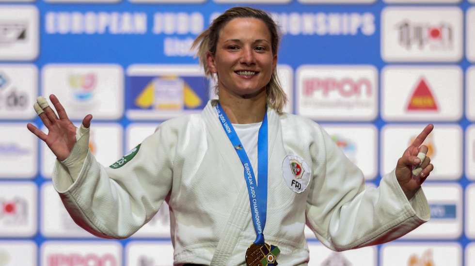 Telma Monteiro of Portugal celebrate during the medals cerimony after winning the gold medal against Kaja Kajzer of Slovenia during the final match in the woman's -57kg category at the European Judo Championships in Lisbon, Portugal, 16 April 2021. NUNO VEIGA/LUSA