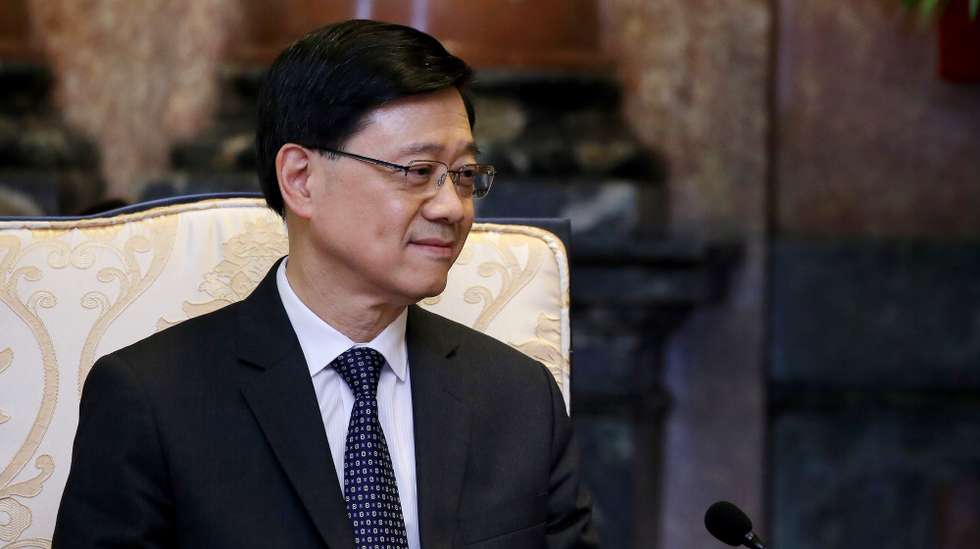 epa11514387 Hong Kong Chief Executive John Lee Ka-Chiu listens to Vietnam’s President To Lam (not pictured) as they meet at the Presidential Palace in Hanoi, Vietnam, 01 August 2024. Lee is on an official visit to Vietnam from 31 July to 01 August 2024.  EPA/LUONG THAI LINH