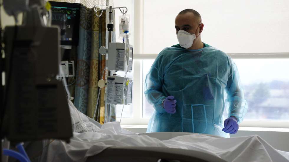epa09799888 Staff on duty at the Intensive Care Unit (ICU) of United Medical Center in Washington DC, USA, 03 March 2022. The United Medical Center is the only public hospital in the District of Colombia and is situated in the southeast of the city serving a prominently low income African-American local population. The District of Colombia has removed vaccine and mask mandates as hospitalisations have dropped dramatically after a surge of the Omicron variant of Covid-19 within the District.  EPA/WILL OLIVER