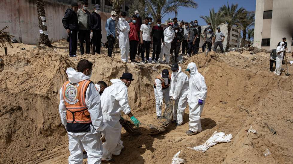 epa11291334 The Palestinian Civil Defense recovers 50 bodies from what they are calling a mass grave inside Nasser Hospital in Khan Yunis, Gaza April 21, 2024. More than 34,000 Palestinians and over 1,450 Israelis have been killed, according to the Palestinian Health Ministry and the Israel Defense Forces (IDF), since Hamas militants launched an attack against Israel from the Gaza Strip on 07 October 2023, and the Israeli operations in Gaza and the West Bank which followed it.  EPA/HAITHAM IMAD