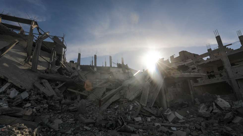 epa11383112 Destroyed buildings are seen during an Israeli military operation in Rafah, southern Gaza, 31 May 2024. The makeshift camp for internally displaced Palestinians previously located in the area was dismantled by Palestinians following an evacuation order by Israeli forces. The International Court of Justice (ICJ) on 24 May ordered Israel to halt its military operation in Rafah, to open the Rafah border crossing with Egypt to allow for the entry of humanitarian aid, to allow access to Gaza for investigators, and to report to the court within one month on its progress. More than 36,000 Palestinians and over 1,400 Israelis have been killed, according to the Palestinian Health Ministry and the Israel Defense Forces (IDF), since Hamas militants launched an attack against Israel from the Gaza Strip on 07 October 2023, and the Israeli operations in Gaza and the West Bank which followed it.  EPA/MOHAMMED SABER