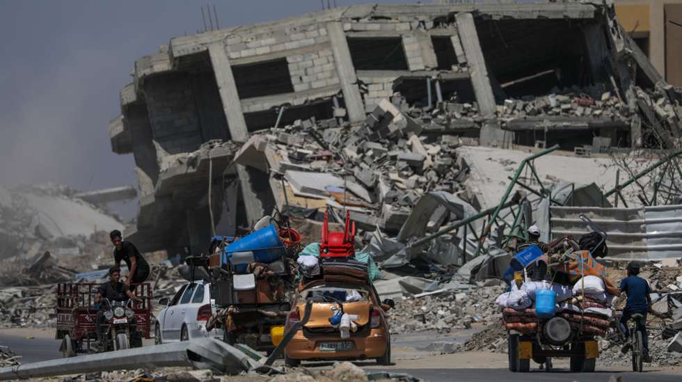 epa11453129 Internally displaced Palestinians leave with their belongings following an evacuation order issued by the Israeli army, in Khan Younis, southern Gaza Strip, 02 July 2024. More than 37,000 Palestinians and over 1,455 Israelis have been killed, according to the Palestinian Health Ministry and the IDF, since Hamas militants launched an attack against Israel from the Gaza Strip on 07 October 2023, and the Israeli operations in Gaza and the West Bank which followed it.  EPA/MOHAMMED SABER