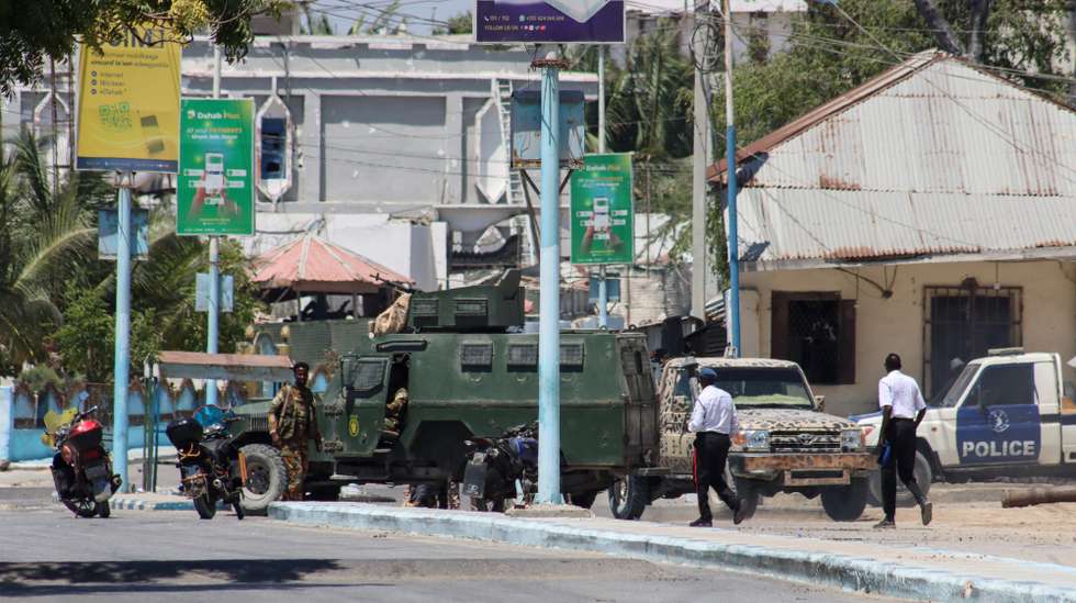 epa11222015 Members of the security forces block a road leading to the SYL Hotel in Mogadishu, Somalia, 15 March 2024. Militants have attacked the SYL Hotel in Somalia's capital Mogadishu, a venue popular with government officials, situated near the presidential palace. The government has not yet issued a statement on the attack, and it is unclear if there were any casualties. The Islamist group al-Shabab has claimed responsibility for the attack.  EPA/SAID YUSUF WARSAME