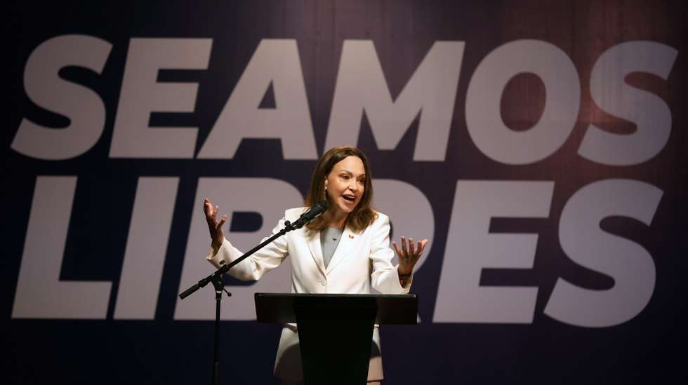 epa13339625 Venezuelan opposition leader and Nobel Peace Prize laureate Maria Corina Machado speaks during a press conference at the Andres Bello Catholic University (UCAB) in Caracas, Venezuela, 29 October 2026. Machado returned to Caracas on 25 October after months in exile to pressure the interim government to establish a clear timeline for free and fair democratic elections.  EPA/MIGUEL GUTIERREZ