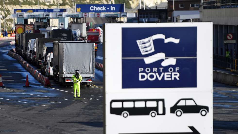 epa08902586 Freight trucks and other vehicles make their way through the Port of Dover in Dover, Britain, 24 December 2020. Dover Port has reopened its border after France closed its border with Britain for 48 hours over concerns about the new coronavirus variant. Lorry drivers must now obtain negative coronavirus tests before they will be allowed to cross by sea and the Port of Dover remains closed to outbound traffic on the morning of 23 December 2020.  EPA/ANDY RAIN