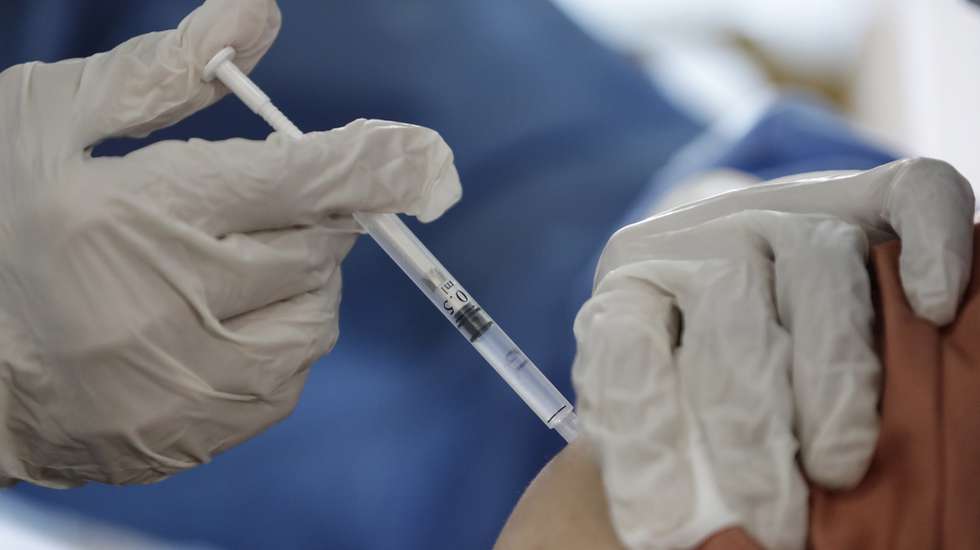 epa08967740 A health worker receives a dose of Covishield Covid-19 vaccine at Yangon General Hospital, in Yangon, Myanmar, 27 January 2021. Myanmar began its vaccination drive after receiving 1,5 million doses of Covishield vaccine from neighboring India.  EPA/LYNN BO BO