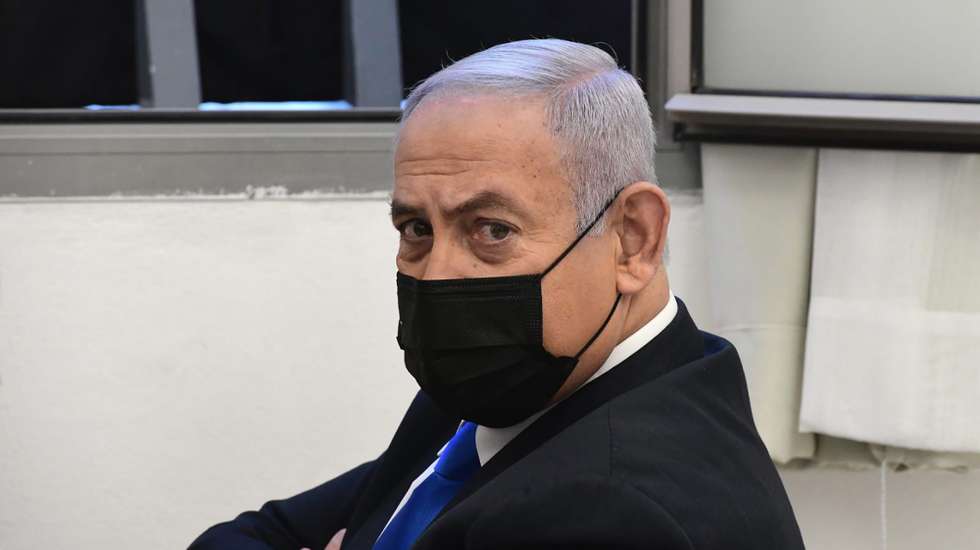 epa08995734 Israeli Prime Minister Benjamin Netanyahu attends a hearing for his trial over alleged corruption crimes, at the Jerusalem district court, in Salah El-Din, East Jerusalem, 08 February 2021. Netanyahu returned to court to formally respond to charges of bribery, fraud and breach of trust, just weeks ahead of the national elections.  EPA/REUVEN CASTRO / POOL