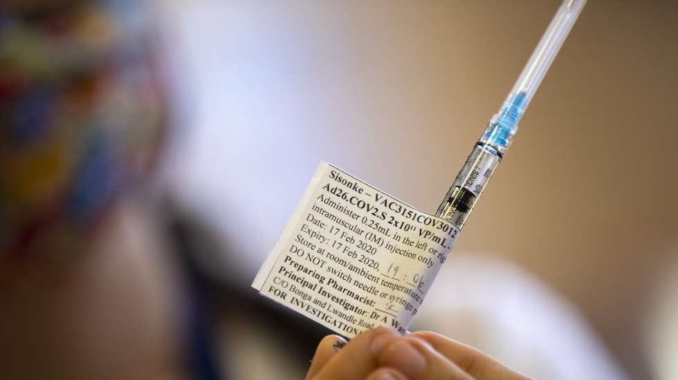 epa09018780 A South African health worker holds a dose of the Johnson and Johnson Covid-19 vaccine during the roll out of the first batch of vaccines at Khayelitsha hospital in Cape Town, South Africa, 17 February 2021. South African President Cyril Ramaphosa was amongst health workers to be the first to receive the vaccine in South Africa.  EPA/NIC BOTHMA