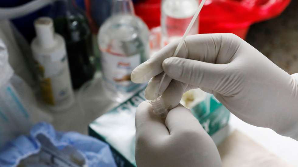 epa09170484 A nurse stores a covid-19 test in Bogota, Colombia, 30 April 2021. This month of April is the worst of the covid-19 pandemic so far in Colombia, with more than 10,000 deaths, daily death records in recent weeks and intensive care units (ICUs) full of seriously ill patients due to the third peak of the disease.  EPA/Carlos Ortega